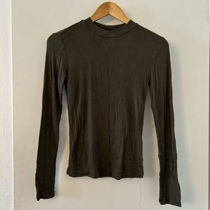Woman’s olive green long sleeve top